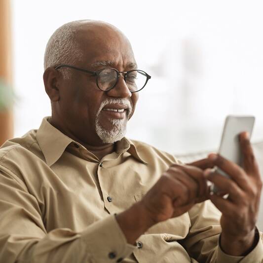 senior man reviewing list of home care package inclusions and exclusions