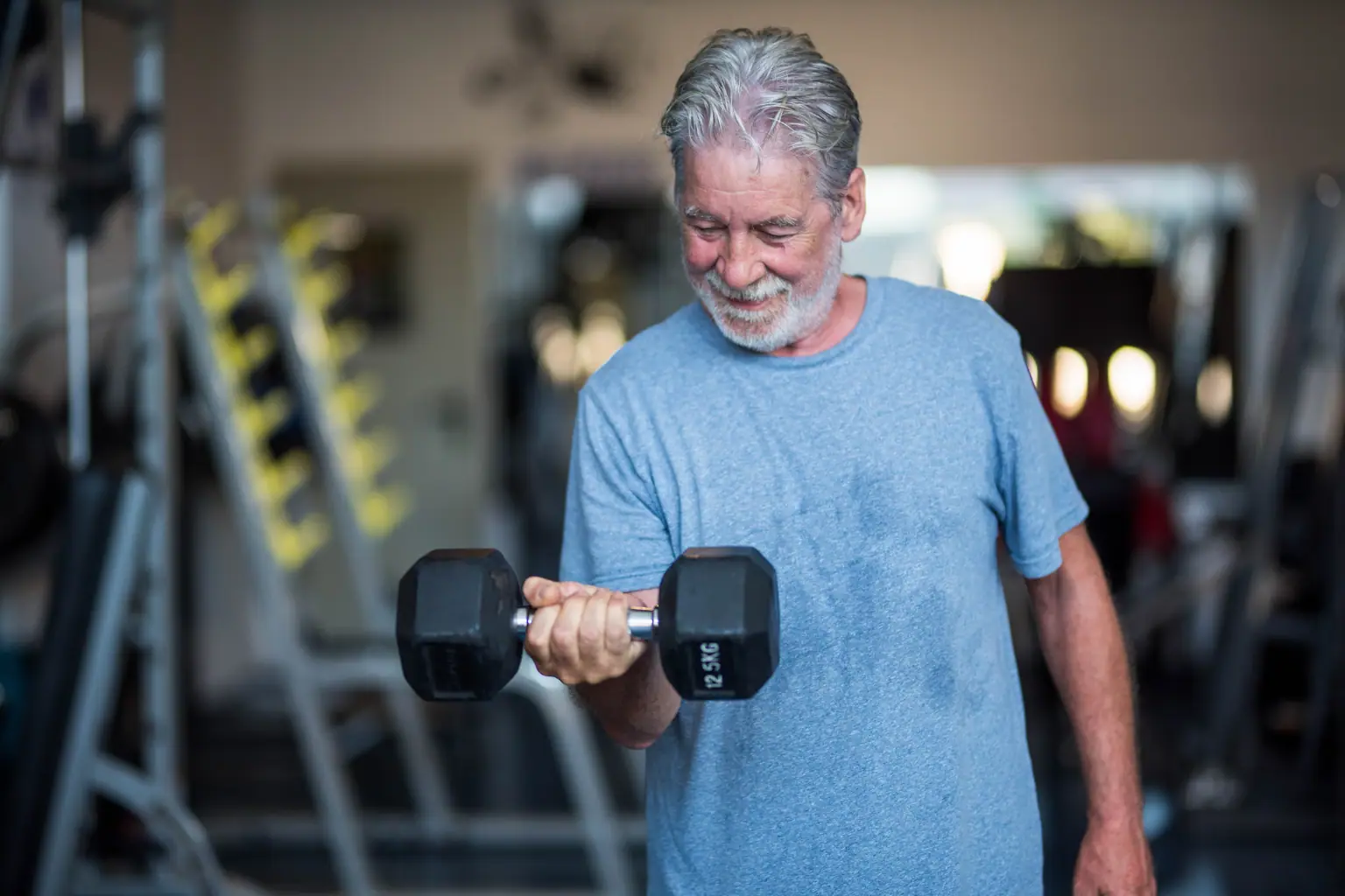 Senior using gym equipment