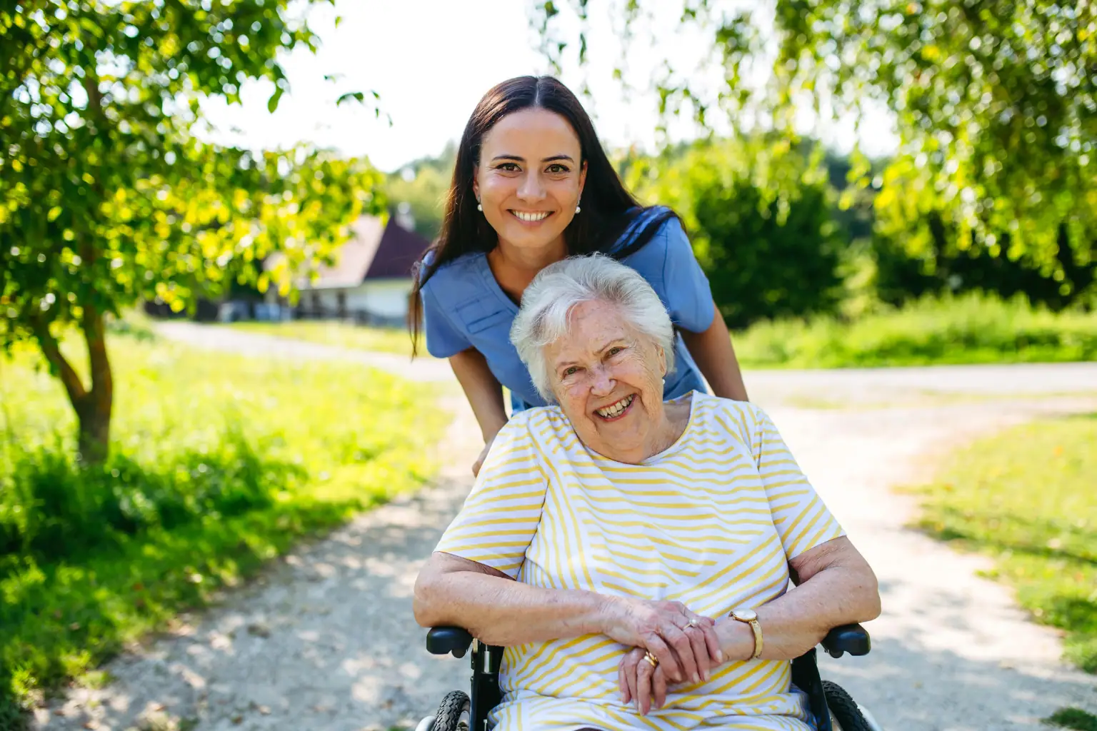 Senior lady in wheel chair with support worker