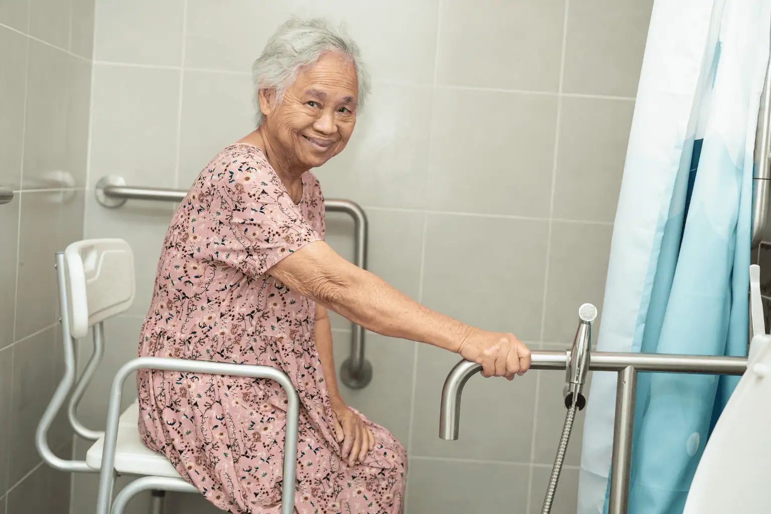 Senior lady using handrailing in bathroom