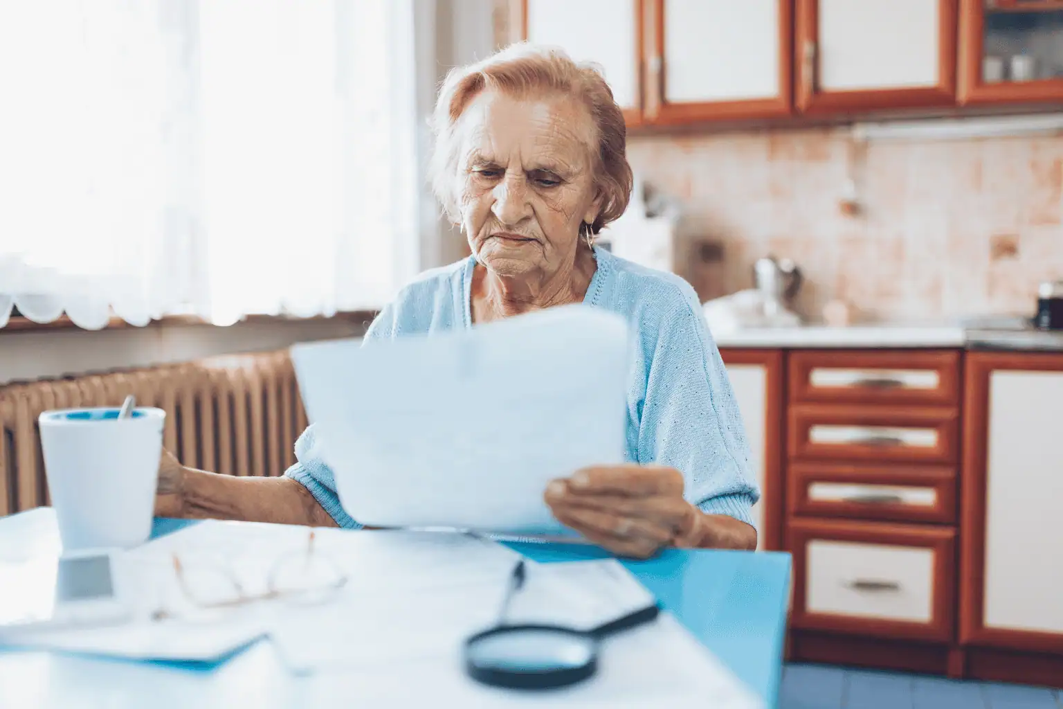 Senior woman looking at statement